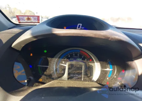 2011 Honda Insight from USA, damaged, VIN JHMZE2H38BS007335